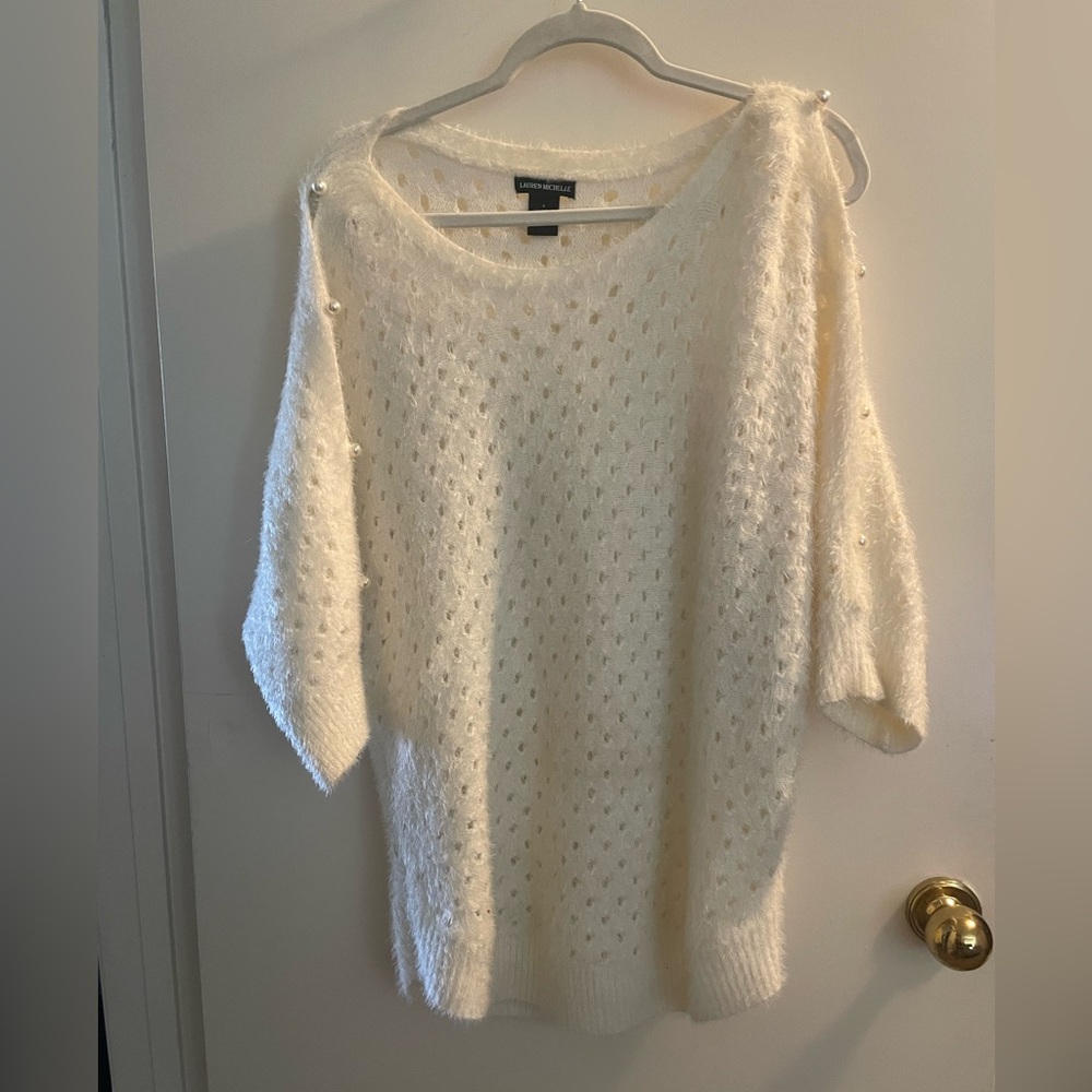Soft furry women’s sweater with pearl button details, cold shoulder